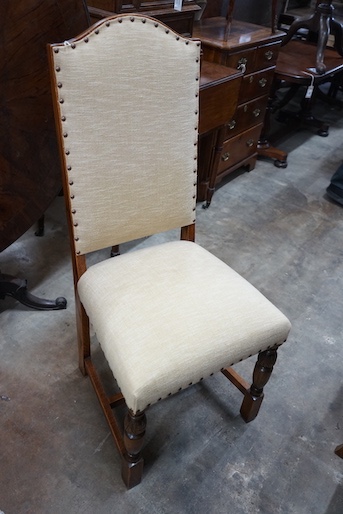 A set of six 18th century style oak dining chairs, with cream upholstered seats and backs